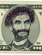 Funny money... doodling on a five dollar bill by giving Abe Lincoln some big hair.